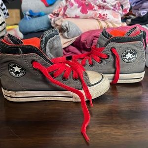 Easy on converse with zipper in back. Barely worn